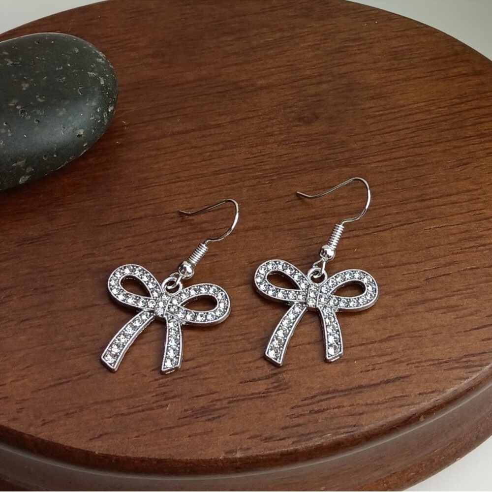 Elegant Silver Tone Bow Earrings - Picture 3 of 3